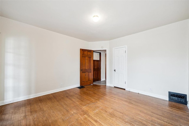 spare room featuring light hardwood / wood-style floors