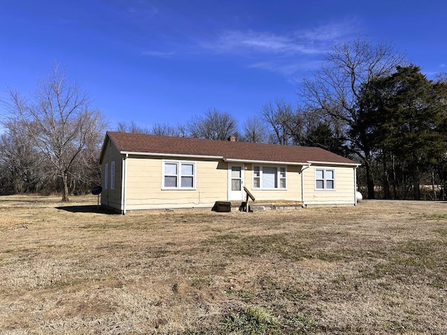 ranch-style home with a front yard