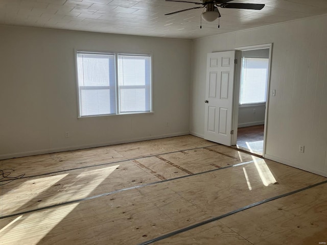 unfurnished room with ceiling fan