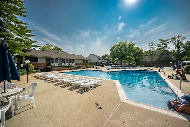 community pool with a patio area