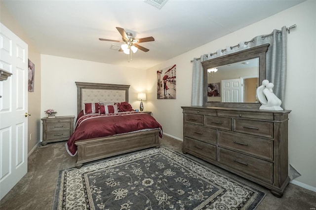 carpeted bedroom featuring baseboards, a ceiling fan, and visible vents
