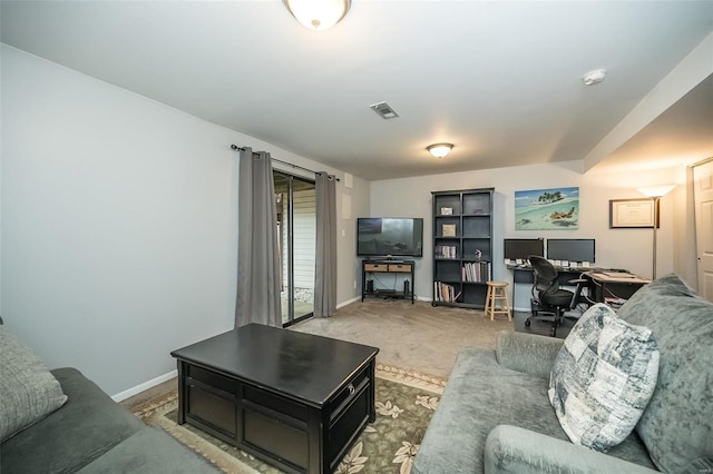 living area featuring baseboards, visible vents, and carpet flooring