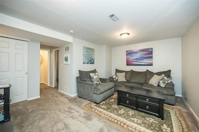 living room featuring visible vents, baseboards, and carpet