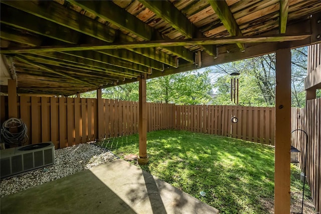 view of yard featuring central AC, a patio, and a fenced backyard