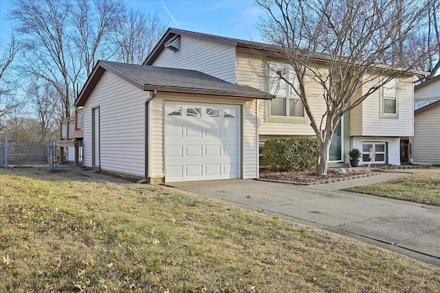 view of front of home with a garage and a front yard