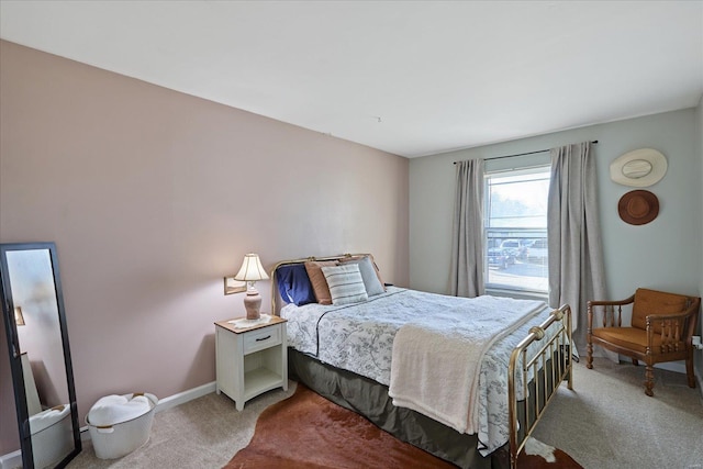 bedroom featuring light carpet