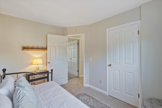 bedroom featuring light colored carpet