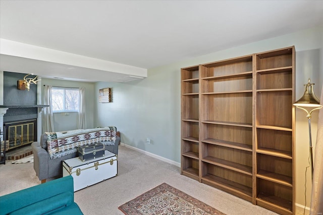 carpeted living room with a fireplace