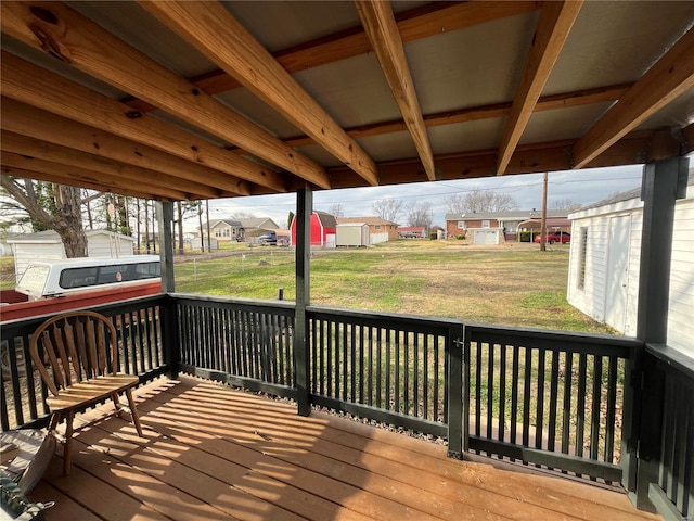 wooden terrace with a yard