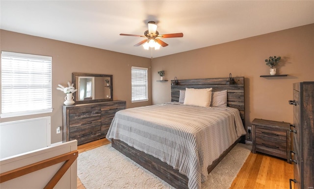 bedroom featuring ceiling fan and light wood-type flooring