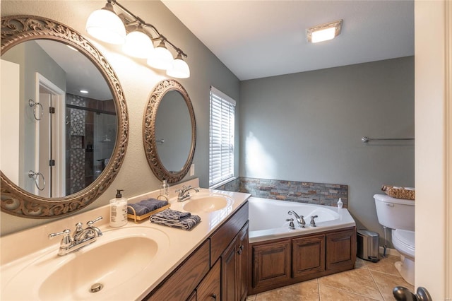 full bathroom featuring tile patterned floors, toilet, separate shower and tub, and vanity