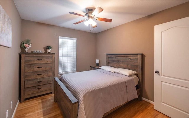 bedroom featuring ceiling fan and light hardwood / wood-style flooring