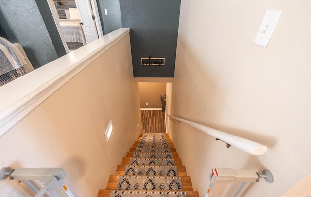 stairway featuring hardwood / wood-style flooring