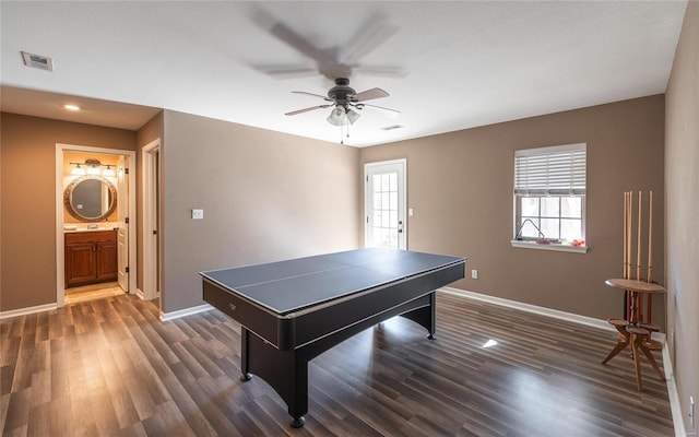 playroom featuring ceiling fan and dark hardwood / wood-style flooring