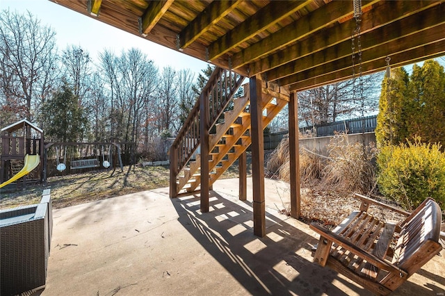 view of patio featuring a playground