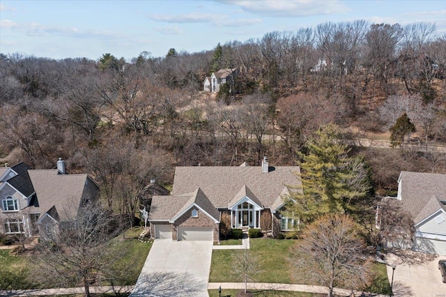 bird's eye view featuring a forest view