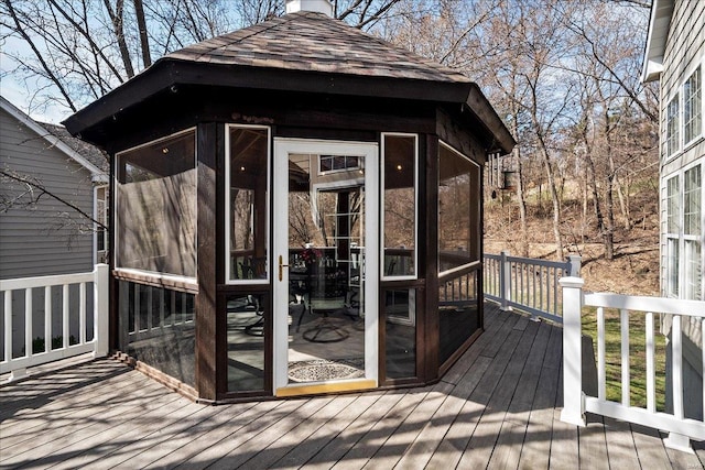 deck with a sunroom