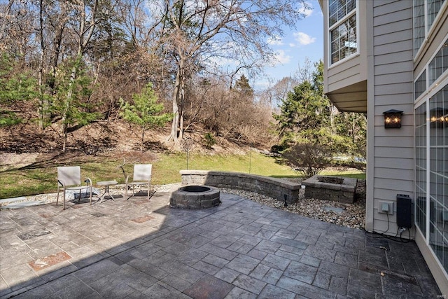 view of patio featuring a fire pit