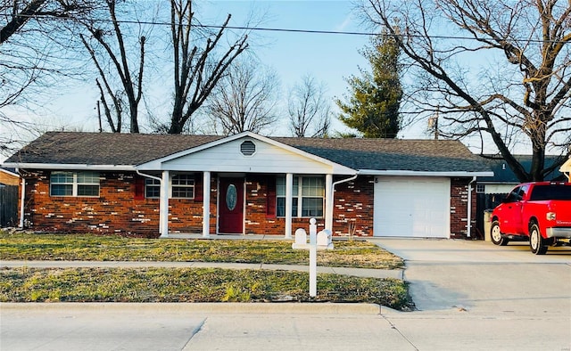 single story home featuring a garage, driveway, roof with shingles, covered porch, and brick siding