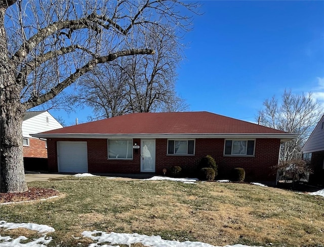 single story home with a garage and a yard