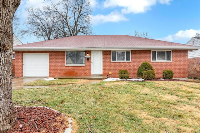 ranch-style home with a garage and a front lawn