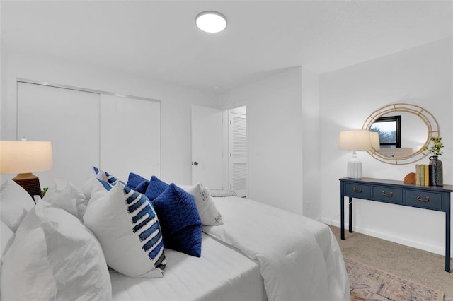 carpeted bedroom featuring a closet