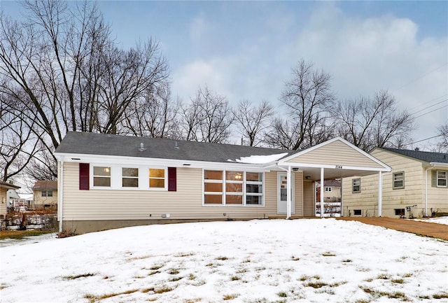 snow covered property featuring covered porch