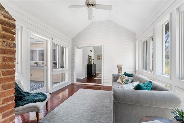 sunroom with ceiling fan and lofted ceiling