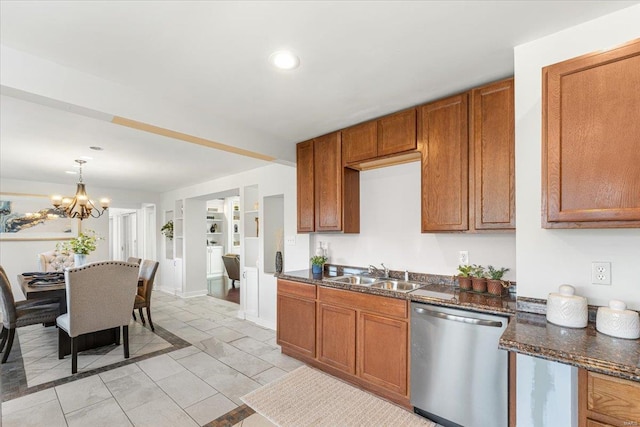 kitchen featuring dishwasher, a notable chandelier, brown cabinets, and a sink