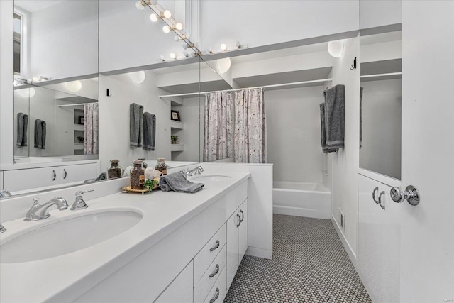 full bath with double vanity, visible vents, shower / tub combo with curtain, and a sink