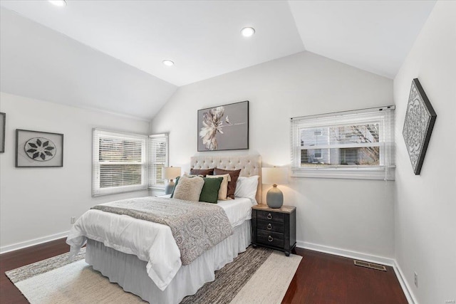 bedroom featuring lofted ceiling, recessed lighting, wood finished floors, and baseboards