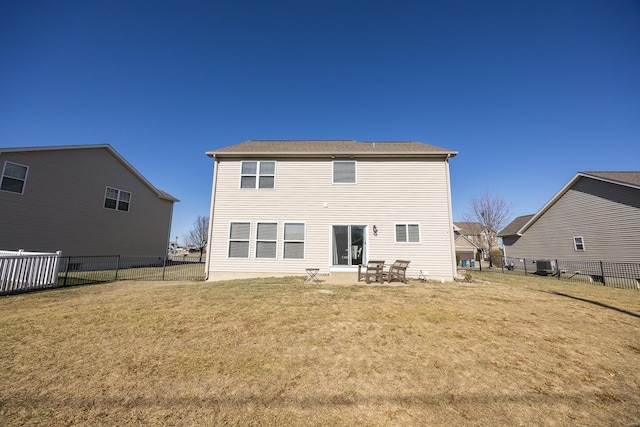 back of house with a yard