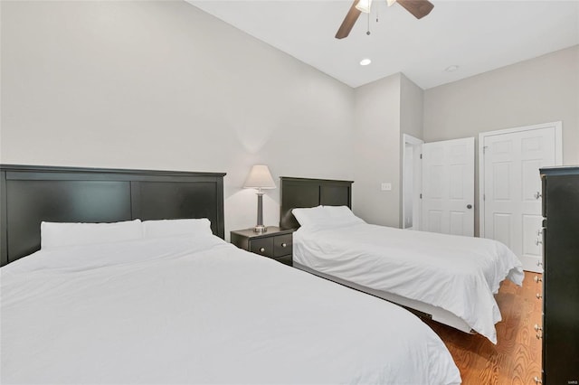 bedroom featuring dark hardwood / wood-style flooring and ceiling fan