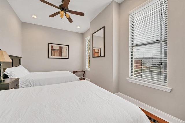 bedroom featuring wood-type flooring and ceiling fan