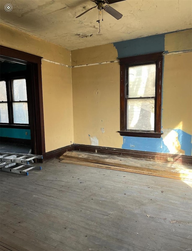 unfurnished room featuring hardwood / wood-style flooring and ceiling fan