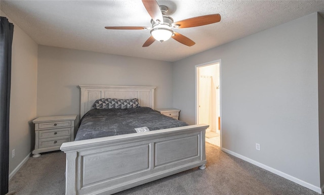 carpeted bedroom featuring ceiling fan, ensuite bath, and a textured ceiling