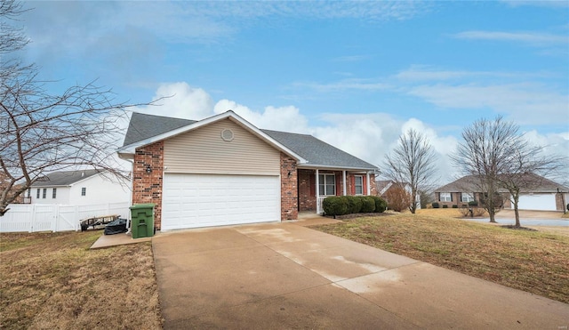 ranch-style house featuring a garage and a front lawn