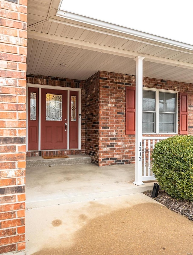 property entrance featuring covered porch