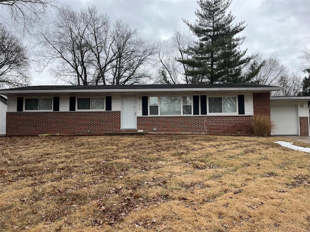 single story home with a garage and a front lawn