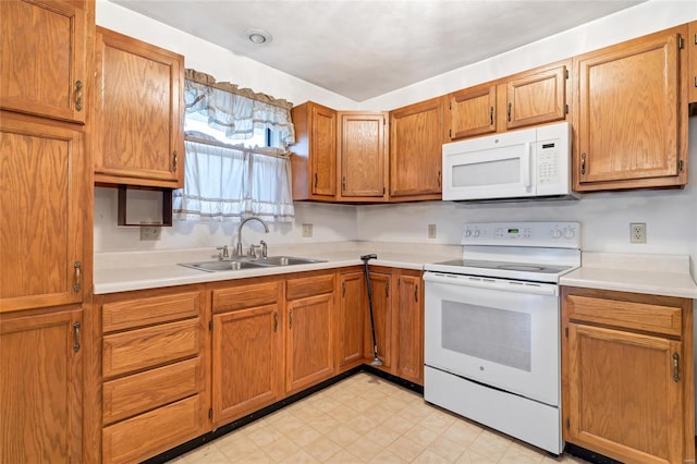 kitchen with sink and white appliances