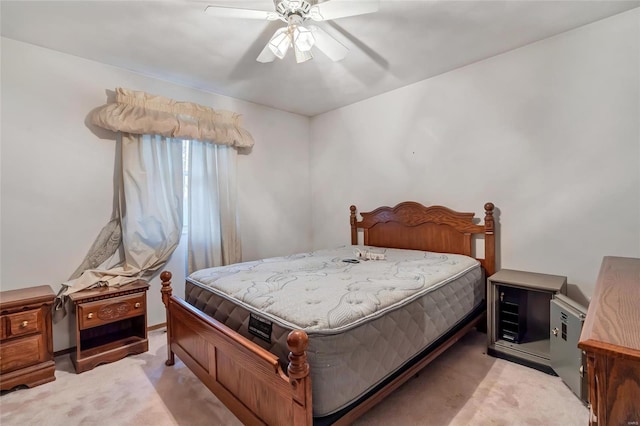 bedroom featuring ceiling fan and light carpet