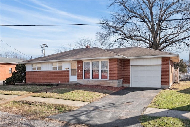 single story home featuring a garage and a front yard