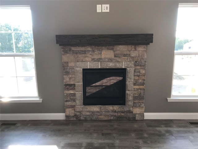 interior details featuring wood-type flooring and a fireplace