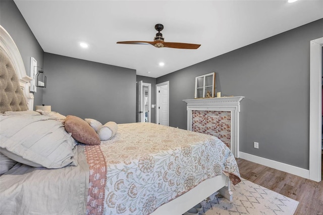 bedroom featuring recessed lighting, ceiling fan, baseboards, and wood finished floors