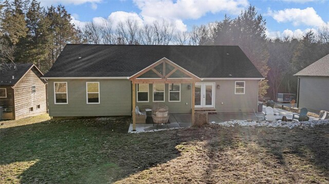 back of house with a lawn, french doors, and a patio