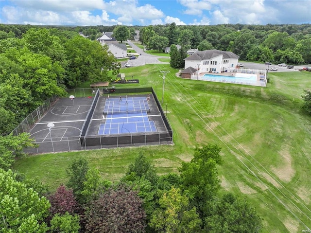 birds eye view of property featuring a wooded view