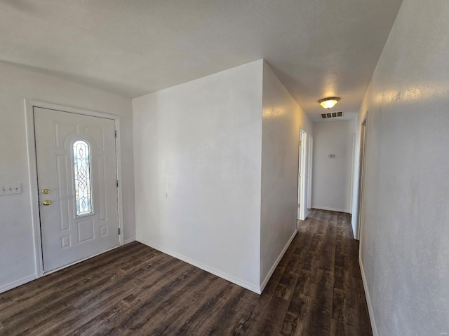 entrance foyer featuring dark hardwood / wood-style floors