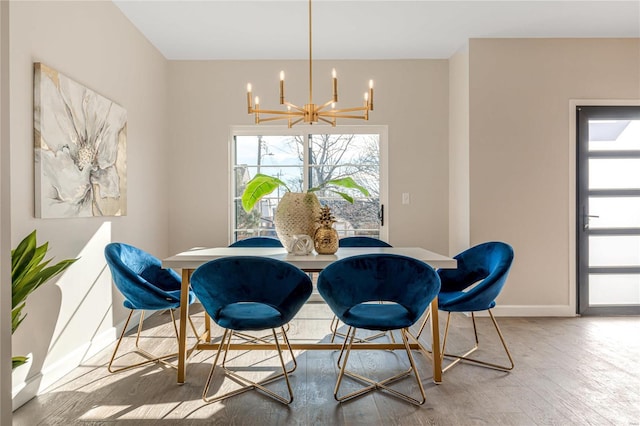 dining space with a notable chandelier and wood-type flooring