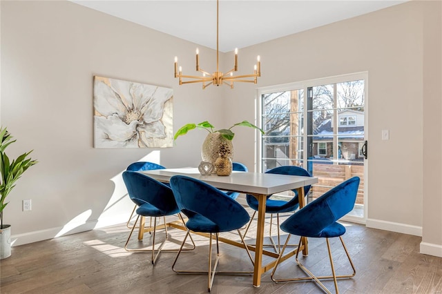 dining room featuring an inviting chandelier and hardwood / wood-style floors