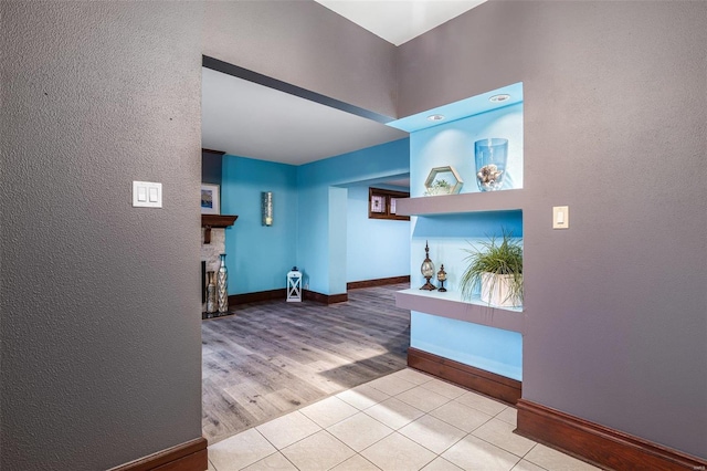 hall with light tile patterned flooring